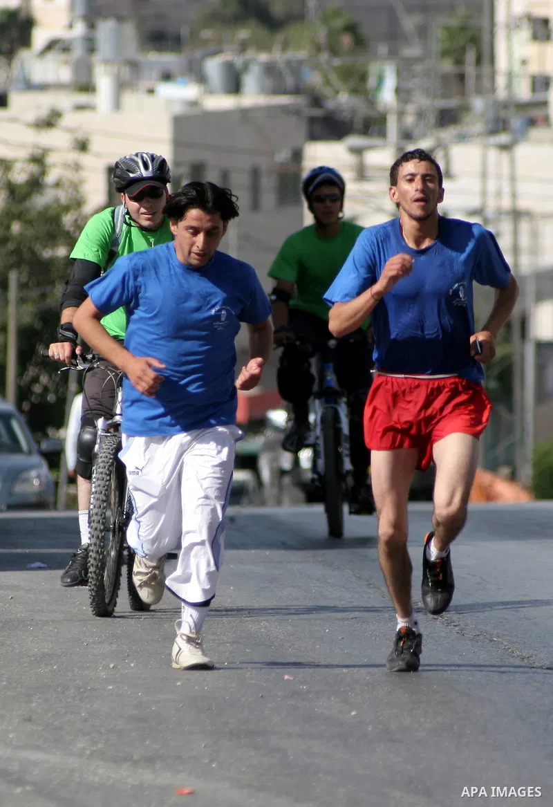 Palestinians run during the marathon in the West Bank city of Hebron on August 6,2010 . Photo by Mamoun Wazwaz