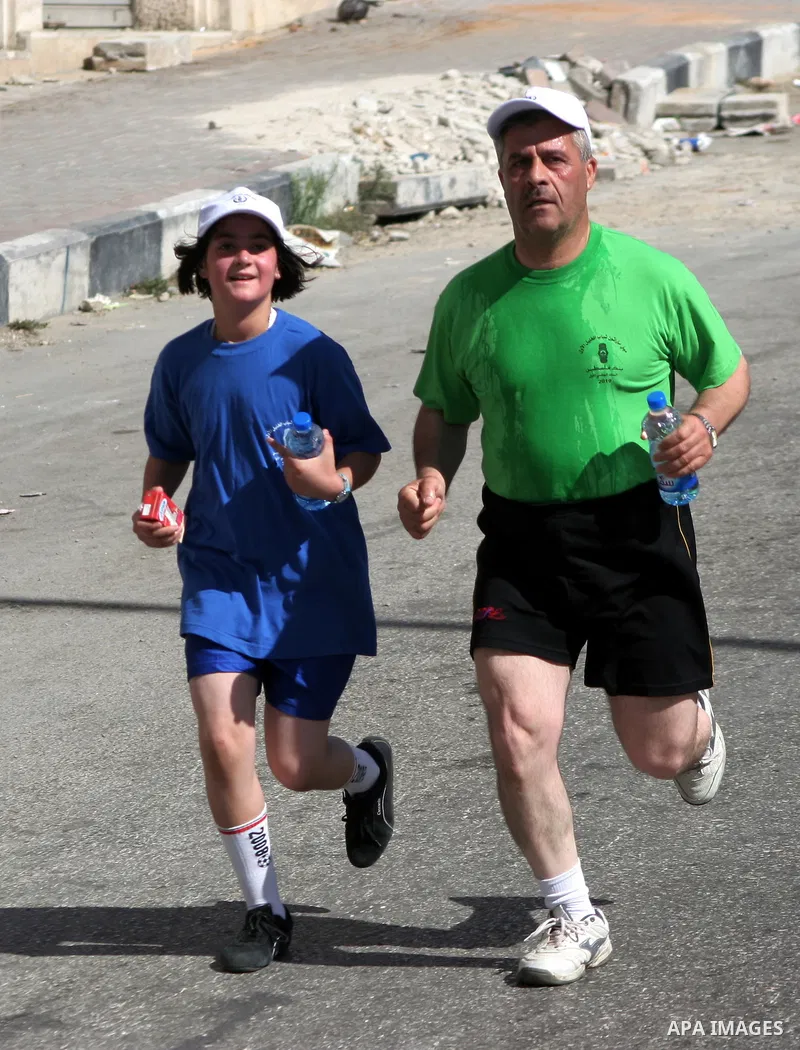 Palestinians run during the marathon in the West Bank city of Hebron on August 6,2010 . Photo by Mamoun Wazwaz