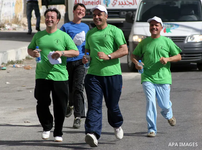 Palestinians run during the marathon in the West Bank city of Hebron on August 6,2010 . Photo by Mamoun Wazwaz