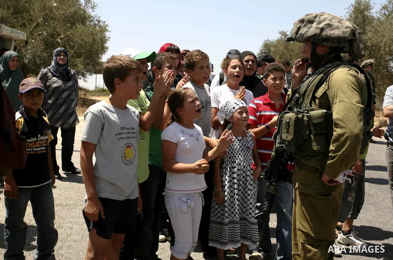 Demonstrators take part in a protest in the West Bank village of Nabi Saleh, on 06 August 2010. Residents of the village protest weekly against the neighbouring Jewish settlement of Halamish and the lack of water supply....