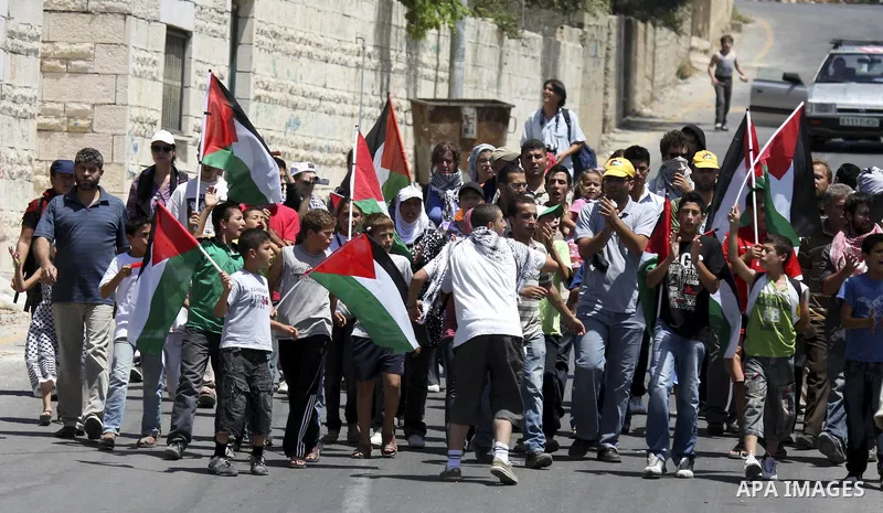 Demonstrators take part in a protest in the West Bank village of Nabi Saleh, on 06 August 2010. Residents of the village protest weekly against the neighbouring Jewish settlement of Halamish and the lack of water supply....