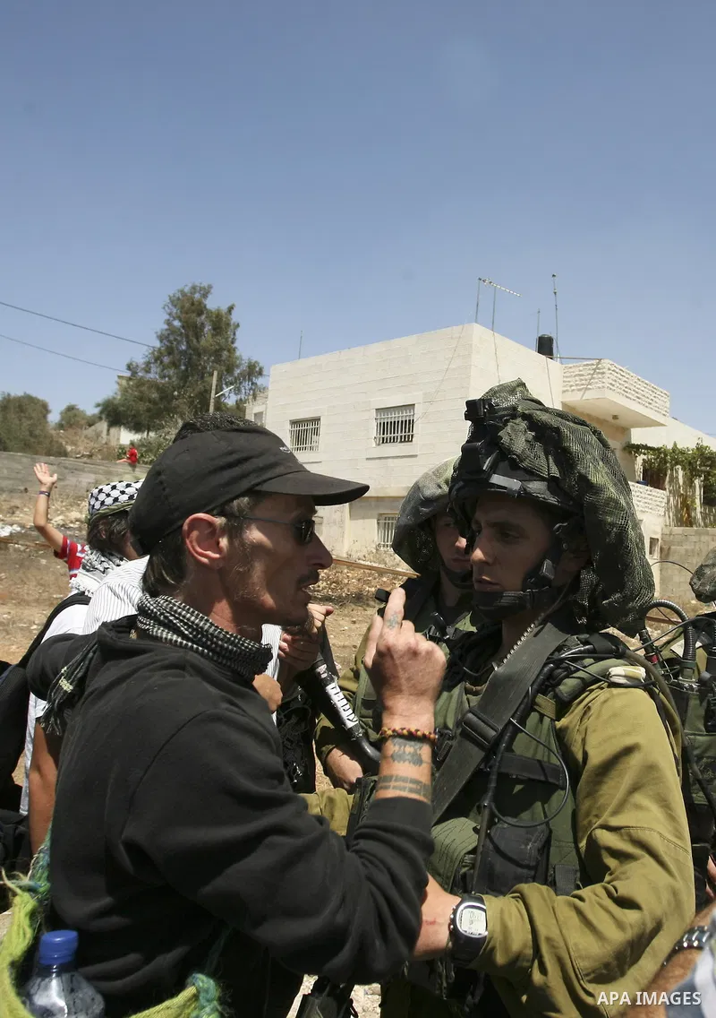 Israeli soldiers scuffle with demonstrators during a protest in the West Bank village of Nabi Saleh, on 06 August 2010. Residents of the village protest weekly against the neighbouring Jewish settlement of Halamish and t...