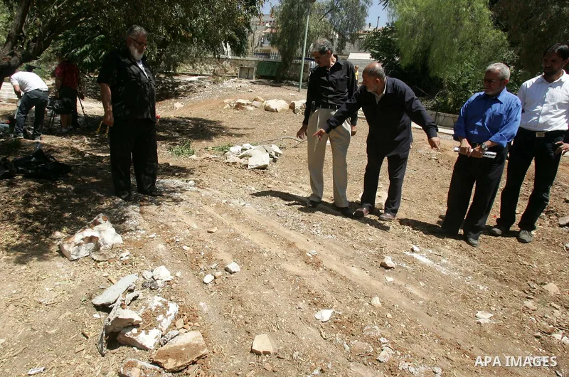Palestinians show the destruction in the graves in the city of Jerusalem on August 6,2010. New plan for the Jerusalem municipality to remove the cemetery of Mamun Allah in West Jerusalem as the graves that marked in red,...