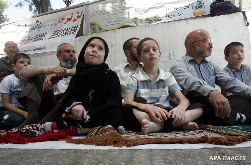 Palestinian lawmakers from Hamas movements Ahmed Atwan, Khaled Abu Arafieh and Muhammad Totah attending the Friday prayer at the International Red Cross Committee (ICRC), headquarter in East Jerusalem August 6,2010. The...