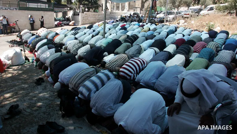 Palestinian lawmakers from Hamas movements Ahmed Atwan, Khaled Abu Arafieh and Muhammad Totah attending the Friday prayer at the International Red Cross Committee (ICRC), headquarter in East Jerusalem August 6,2010. The...