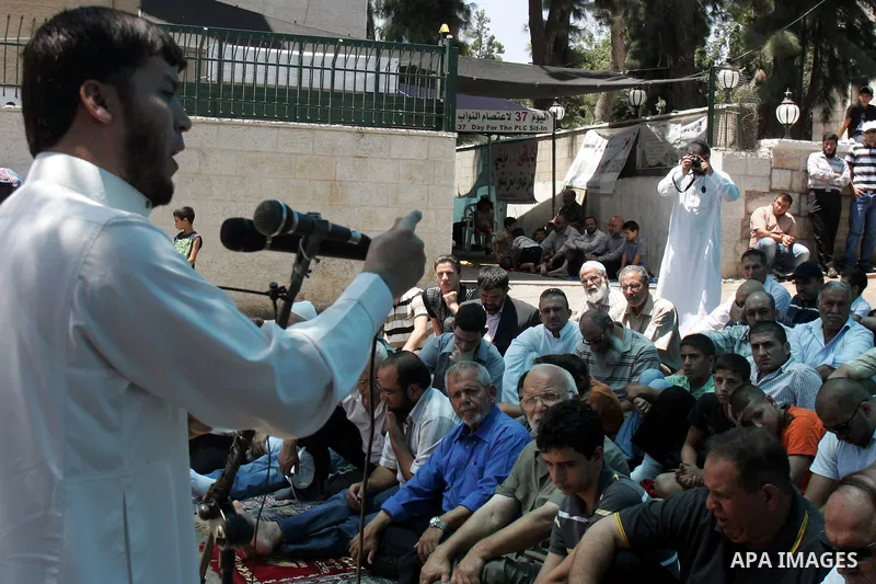 Palestinian lawmakers from Hamas movements Ahmed Atwan, Khaled Abu Arafieh and Muhammad Totah attending the Friday prayer at the International Red Cross Committee (ICRC), headquarter in East Jerusalem August 6,2010. The...