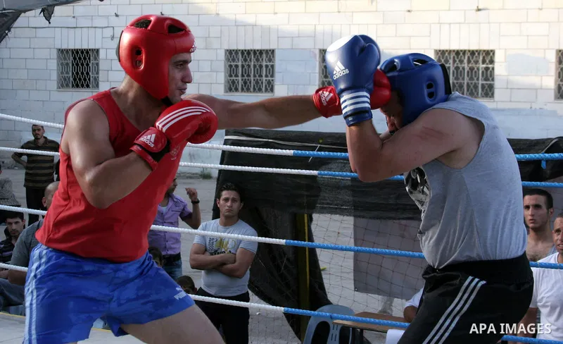Palestinian players participate in a boxing match in the West Bank city of Hebron on August 6,2010. The players came from the different occupied West Bank cities. Photo by Mamoun Wazwaz