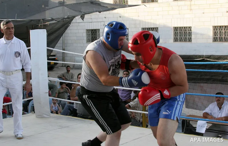 Palestinian players participate in a boxing match in the West Bank city of Hebron on August 6,2010. The players came from the different occupied West Bank cities. Photo by Mamoun Wazwaz