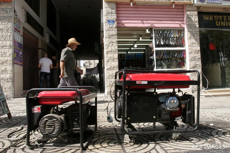 Palestinian man uses an electric generator as the lack of fuel to Gaza's power station, and the continued power outages in the city, on August 9, 2010 in Gaza City. Photo by Mohammed Asad