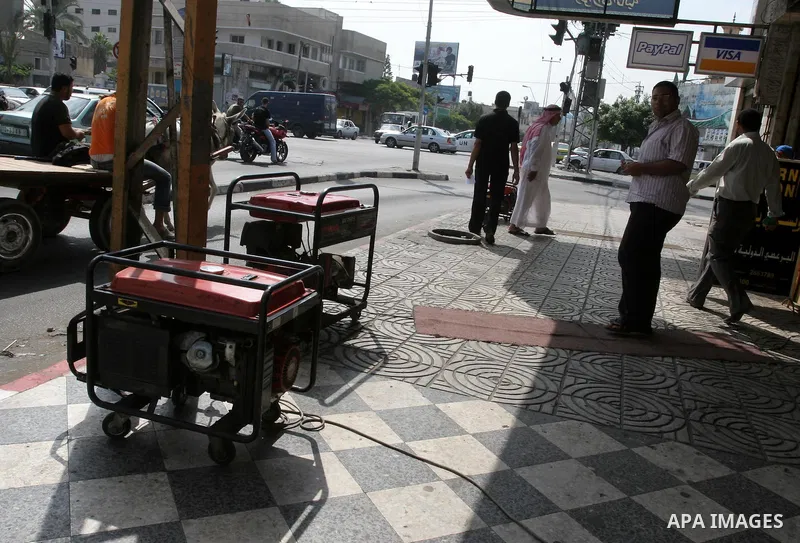 Palestinian man uses an electric generator as the lack of fuel to Gaza's power station, and the continued power outages in the city, on August 9, 2010 in Gaza City. Photo by Mohammed Asad
