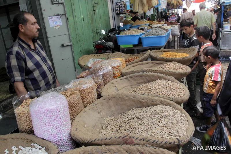 Palestinians shop at a traditional market on the eighth day of the holy month of Ramadan in Gaza City on August 18,2010. Muslims around the world abstain from eating, drinking and sexual relations from sunrise to sunset...
