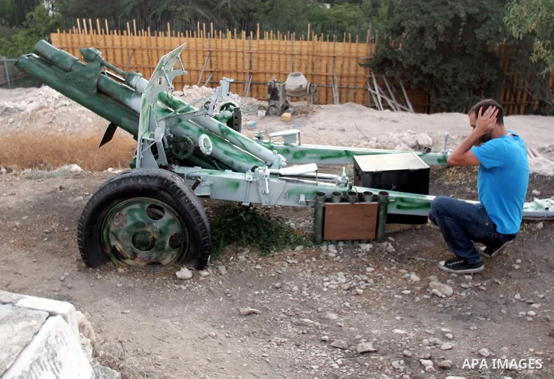 The traditional Ramadan cannon, which marks sunset and the end of the fasting day for observant Muslims, is fired from the Muslim cemetery on Salah Eddein street in Jerusalem on August 19, 2010. Photo by Mahfouz Abu Turk