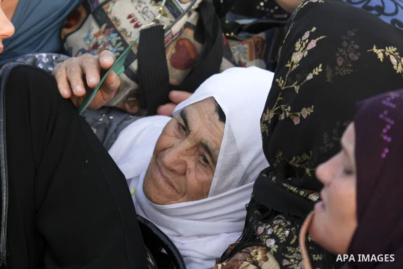 Palestinian women wait to cross the Kalandia checkpoint between the West Bank city of Ramallah and Jerusalem, manned by Israeli border police officers, to attend prayers at the Al Aqsa Mosque on the second Friday of the...