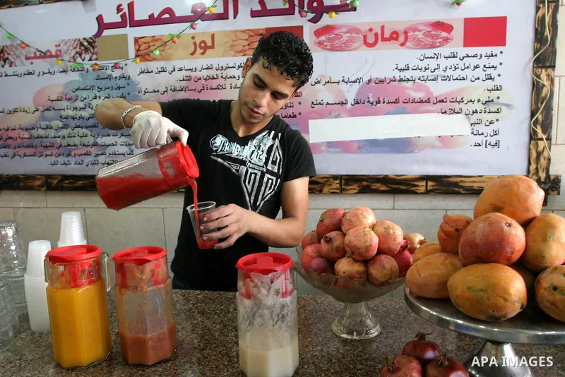 Palestinian vendor prepares different types of juice at his shop on the nineteenth day of the holy month of Ramadan in Gaza City on August 29,2010 . Muslims all over the world fast from dawn to dusk during the holy month...