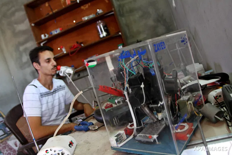 Monzer al-Qasas, a Palestinian inventor who works on electronic machine for the disabled, is seen at his home in Gaza City, on August 31, 2010. The 30-year-old man invents electronic machines to help the disabled who hav...