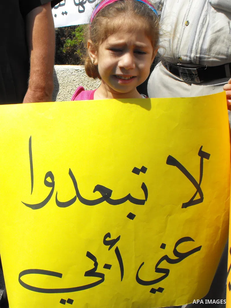 Palestinians protest at the Red Cross yard in East Jerusalem on Sept 2,2010, in solidarity with PLC members and former Palestinian minister Ahmad Atwon, Mohammad Totah and Khalid Abu Arfeh. After the Israeli authorities...