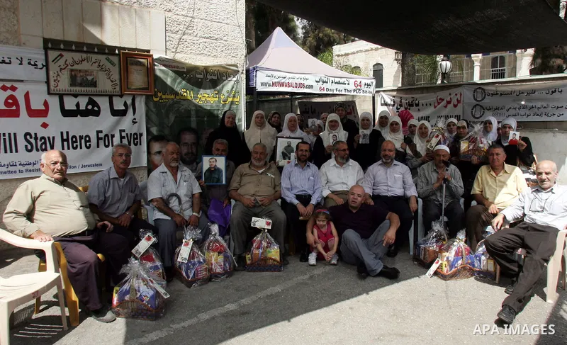 Palestinians protest at the Red Cross yard in East Jerusalem on Sept 2,2010, in solidarity with PLC members and former Palestinian minister Ahmad Atwon, Mohammad Totah and Khalid Abu Arfeh. After the Israeli authorities...