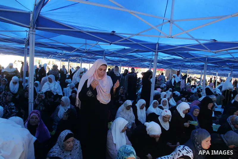 Palestinian Muslim women pray in front of the Dome of the Rock on the compound known to Muslims as al-Haram al-Sharif and to Jews as Temple Mount during the final Friday of the holy month of Ramadan in Jerusalem's Old Ci...