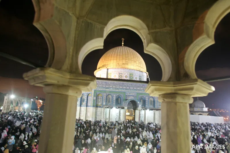 Muslim women pray during Laylat al-Qadr in front of the Dome of the Rock, on the compound known to Muslims as al-Haram al-Sharif and to Jews as Temple Mount, in Jerusalem's Old City during the Muslim holy month of Ramada...