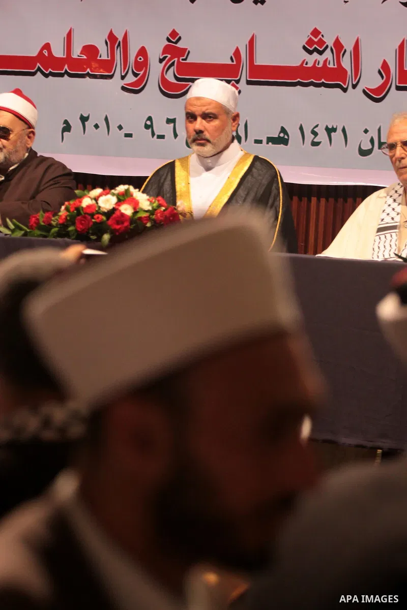 Palestinian Prime Minister in Gaza Strip, Ismail Haniyeh takes his breakfast during the Islamic holy month of Ramadan with Palestinian religious characters in Gaza city on Sept. 6,2010. Muslims abstain from drinking, eat...