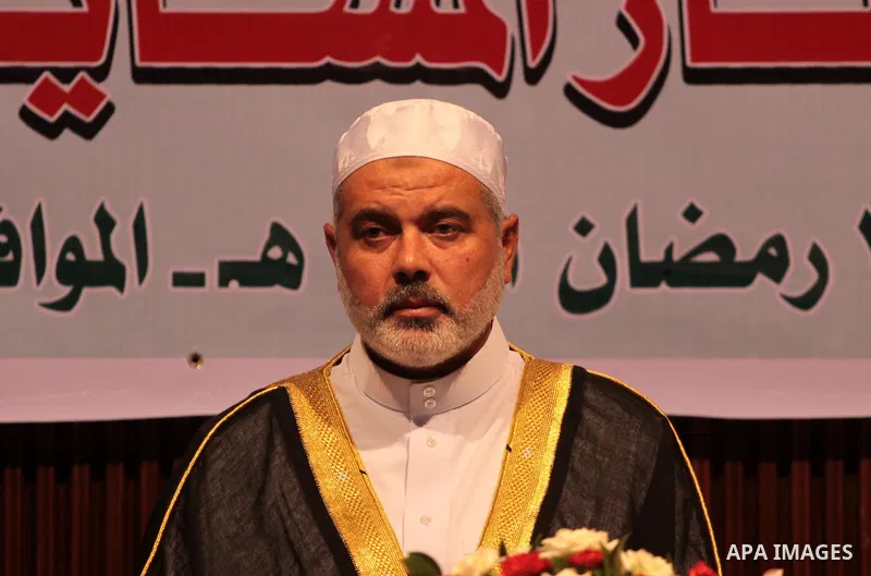 Palestinian Prime Minister in Gaza Strip, Ismail Haniyeh takes his breakfast during the Islamic holy month of Ramadan with Palestinian religious characters in Gaza city on Sept. 6,2010. Muslims abstain from drinking, eat...