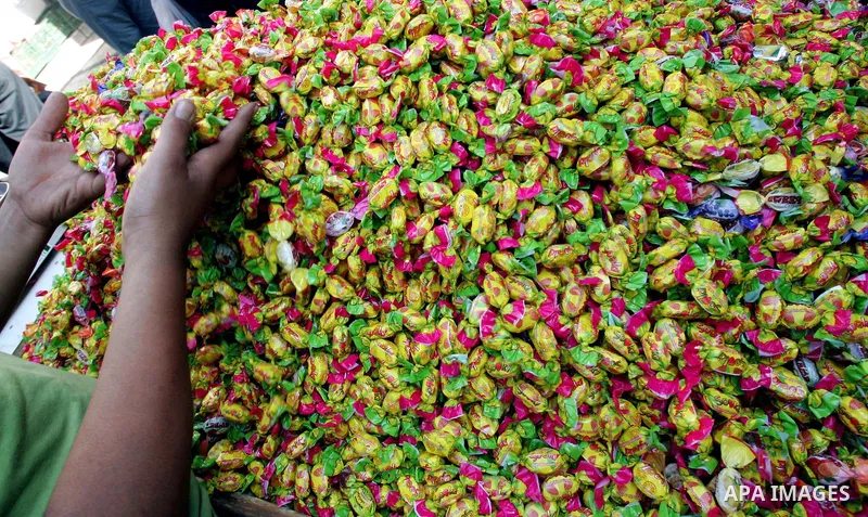 A Palestinian vendor sells sweets at a market ahead of the Eid al-Fitr, marking the end of the Muslim holy month of Ramadan in Jerusalem's Old City September 8, 2010. Photo by Mahfouz Abu Turk