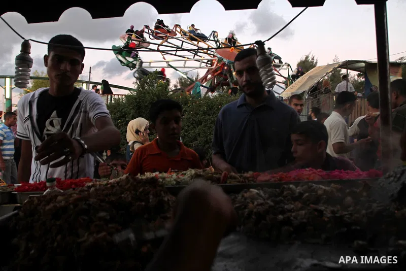 Palestinians enjoy rides during the fourth day of Eid al-Fitr which marks the end of the Muslim fasting month of Ramadan, in Gaza City, Friday, Sept. 13, 2010. Eid, one of the most important holidays in the Muslim world,...
