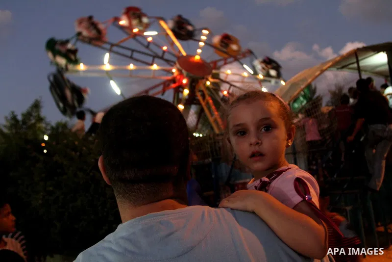 Palestinians enjoy rides during the fourth day of Eid al-Fitr which marks the end of the Muslim fasting month of Ramadan, in Gaza City, Friday, Sept. 13, 2010. Eid, one of the most important holidays in the Muslim world,...