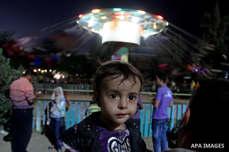 Palestinians enjoy rides during the fourth day of Eid al-Fitr which marks the end of the Muslim fasting month of Ramadan, in Gaza City, Friday, Sept. 13, 2010. Eid, one of the most important holidays in the Muslim world,...