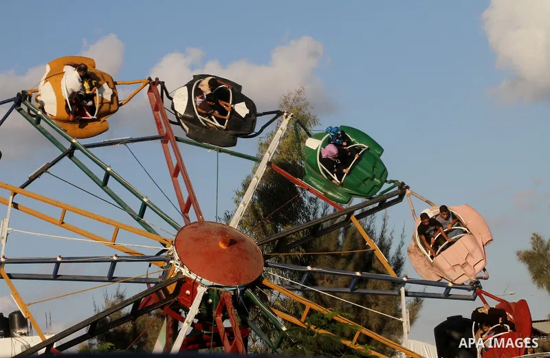 Palestinians enjoy rides during the fourth day of Eid al-Fitr which marks the end of the Muslim fasting month of Ramadan, in Gaza City, Friday, Sept. 13, 2010. Eid, one of the most important holidays in the Muslim world,...