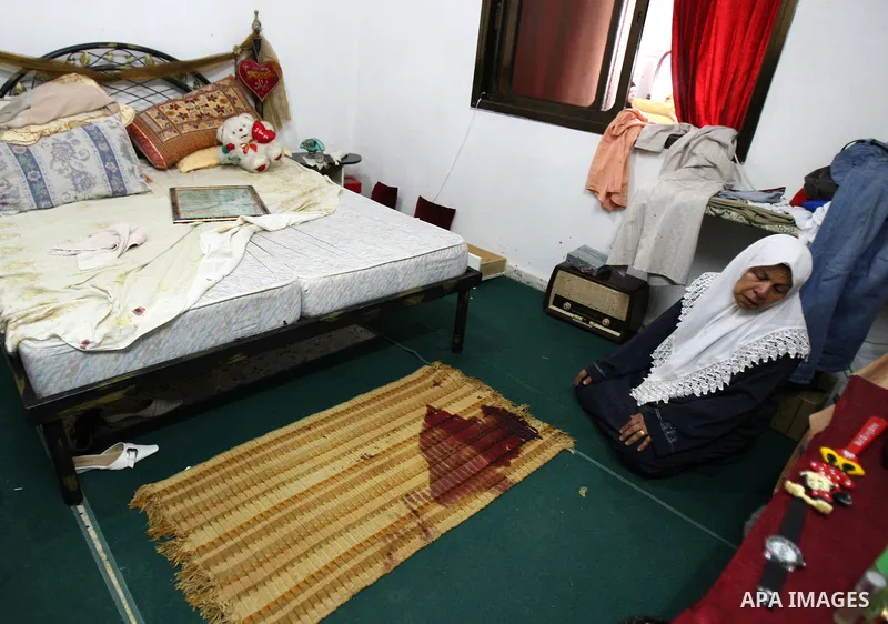 A Relative of Eyad Shilbaya, a 38-year-old local leader of the armed wing of the Islamist movement Hamas, weeps next to the spot where he was shot dead by Israeli soldiers on September 17, 2010 inside his bedroom in the...