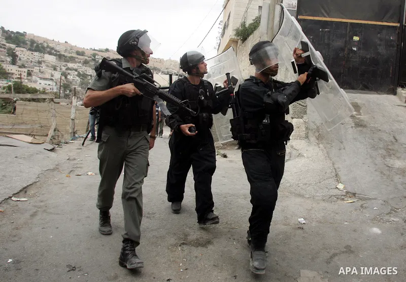 Israeli policemen take position during the clashes in the east Jerusalem neighborhood of Silwan, Wednesday, Sept. 22, 2010. Violence erupted after a 32-year-old Palestinian laborer was killed by a private security guard...