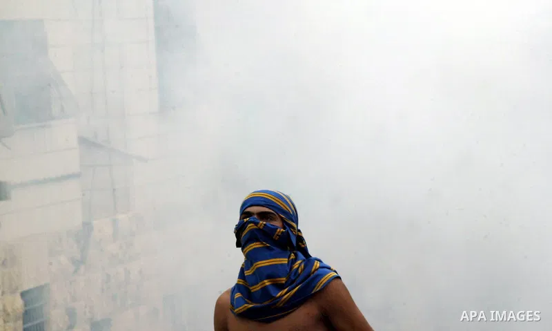 Palestinian youths hurl stones at Israeli soldiers during the clashes in the east Jerusalem neighborhood of Silwan, Wednesday, Sept. 22, 2010. Violence erupted after a 32-year-old Palestinian laborer was killed by a priv...