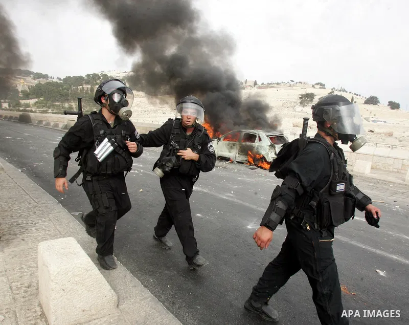 Israeli policemen take position during the clashes in the east Jerusalem neighborhood of Silwan, Wednesday, Sept. 22, 2010. Violence erupted after a 32-year-old Palestinian laborer was killed by a private security guard...