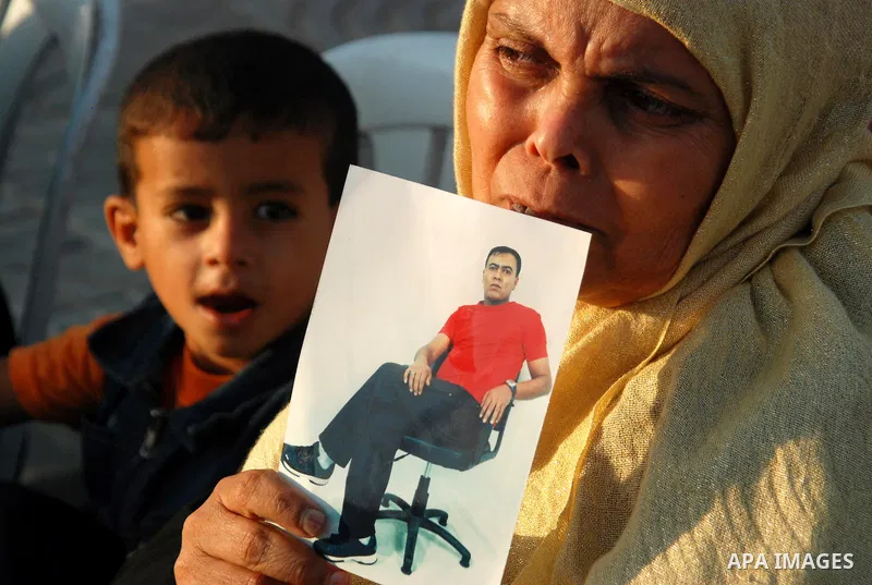 Palestinians women hold pictures of relatives held in Israeli jails during a protest against the Israeli attacks on Palestinian prisoners and to demand their release , in Gaza City on Sept. 23,2010 . Photo by Yousef Deeb