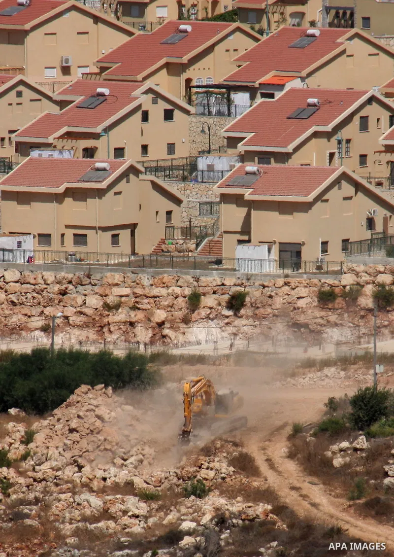 Israeli earth-moving equipment works in the Jewish settlement of Kiryat Netafim, near the West Bank village of Salfit, Monday on Sept. 27, 2010. Senior Palestinian official Yasser Abed Rabbo said Monday that President Ma...