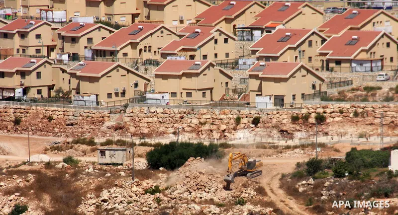 Israeli earth-moving equipment works in the Jewish settlement of Kiryat Netafim, near the West Bank village of Salfit, Monday on Sept. 27, 2010. Senior Palestinian official Yasser Abed Rabbo said Monday that President Ma...