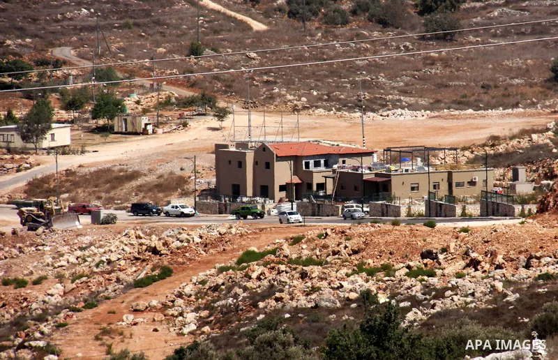 Israeli earth-moving equipment works in the Jewish settlement of Kiryat Netafim, near the West Bank village of Salfit, Monday on Sept. 27, 2010. Senior Palestinian official Yasser Abed Rabbo said Monday that President Ma...