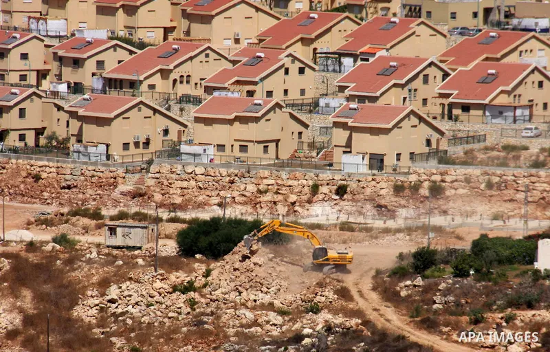 Israeli earth-moving equipment works in the Jewish settlement of Kiryat Netafim, near the West Bank village of Salfit, Monday on Sept. 27, 2010. Senior Palestinian official Yasser Abed Rabbo said Monday that President Ma...