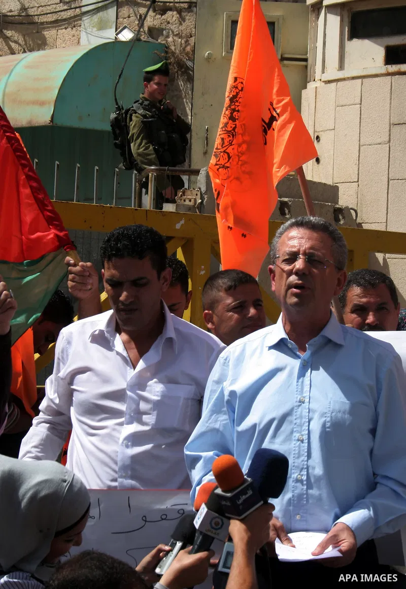 The Chief of the National Initiative Party, Mustafa Barghouti takes part in a demonstration in the old city of the West Bank city of Hebron on Sept. 27,2010 against the Israeli settlements. Israel let a moratorium on new...