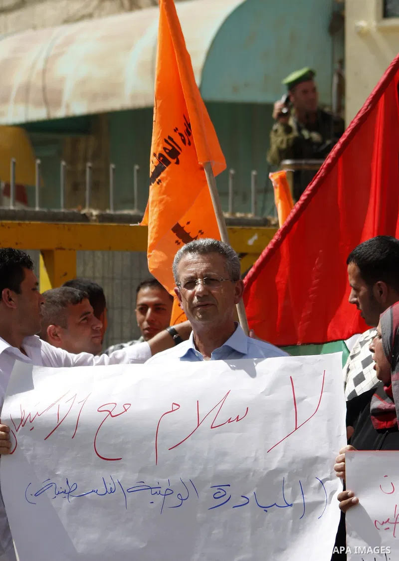The Chief of the National Initiative Party, Mustafa Barghouti takes part in a demonstration in the old city of the West Bank city of Hebron on Sept. 27,2010 against the Israeli settlements. Israel let a moratorium on new...