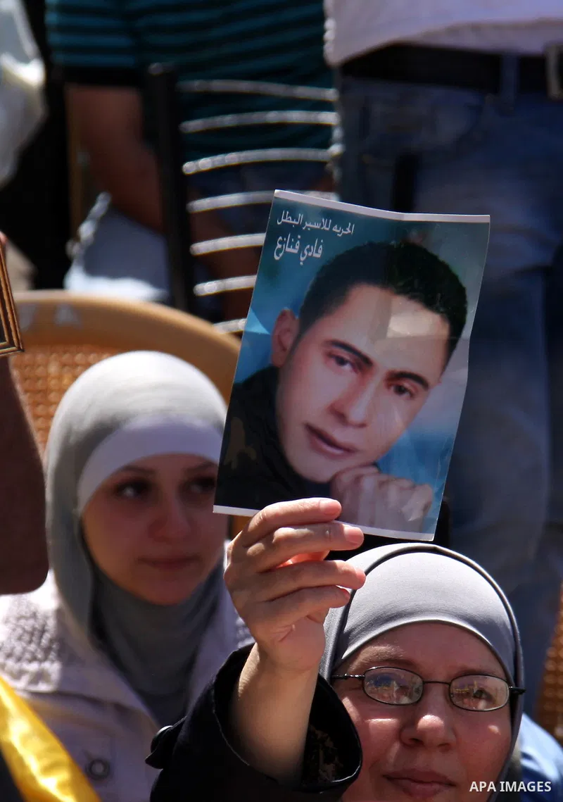Palestinian women hold pictures of relatives, held in Israeli jails, during a protest calling for their release in the West Bank city of Nablus, Wednesday on Sept. 29, 2010 . Photo by Wagdi Eshtayah