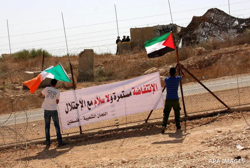 Palestinians and foreign activists take part in a protest against Israel's separation barrier in the West Bank village of Bilin near Ramallah, Friday, Oct. 1, 2010. U.S. Middle East envoy George Mitchell was shuttling be...