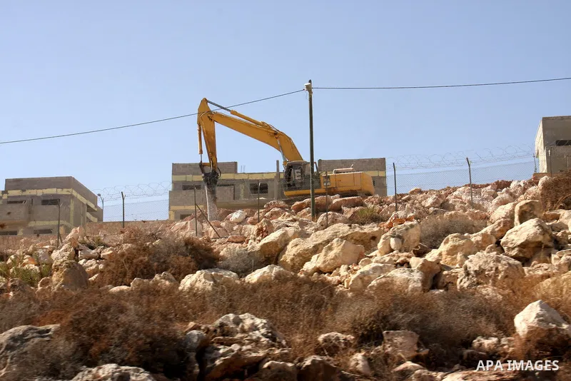 Israeli bulldozers work on the site of a new housing project as Jewish settlement in the West Bank of Ramallah, Friday, Oct. 1, 2010 . Photo by Wagdi Eshtayah . Photo by Wagdi Eshtayah
