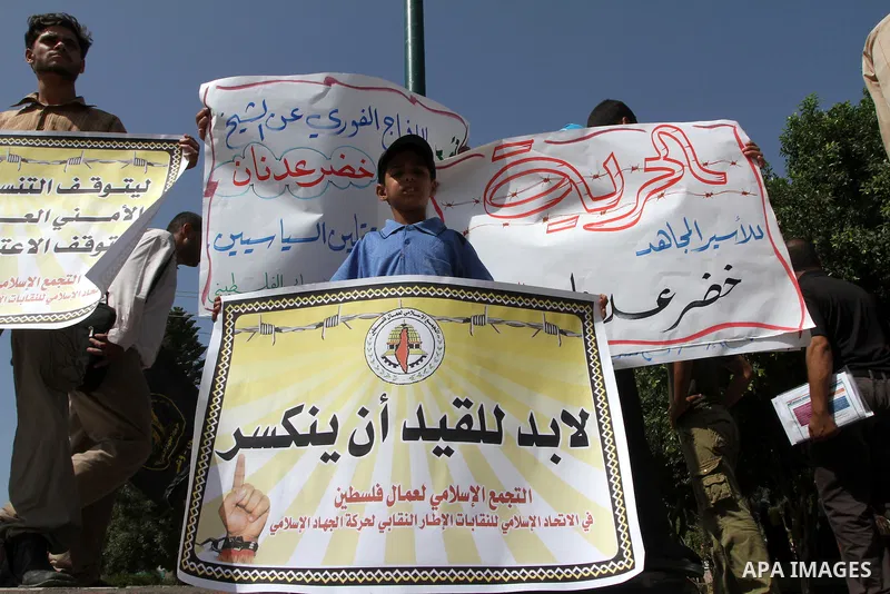 Palestinians from Islamic Jihad movement attends a protest against security coordination between the Palestinian Authority in the West Bank and Israel , and demand the release of detained politicians , in Gaza City on Oc...