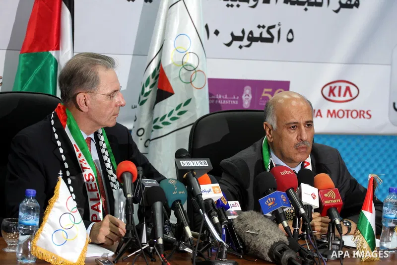 The president of the International Olympic Committee (IOC) Jacques Roggue and Palestinian Jebril Alrojob, head of Palestinian Olympic committee speak during a press conference in the West Bank City of Ramallah, 05 Octobe...