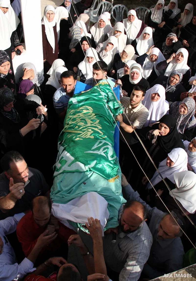 Palestinians carry the body of senior Hamas militant Nashat al-Karmi during his funeral, in the West Bank city of Tulkarem, Friday, Oct. 8, 2010. Israeli troops killed two senior Hamas militants in an early-morning raid...