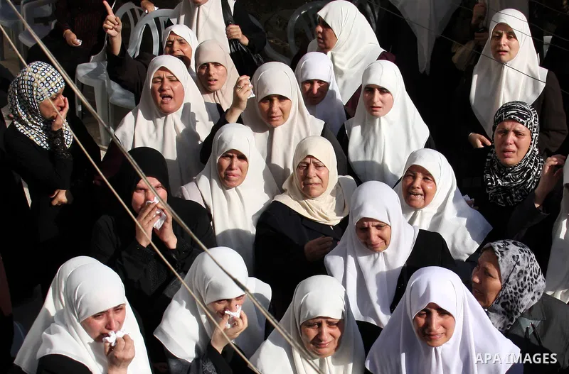 Palestinians mourn the body of senior Hamas militant Nashat al-Karmi during his funeral, in the West Bank city of Tulkarem, Friday, Oct. 8, 2010. Israeli troops killed two senior Hamas militants in an early-morning raid...