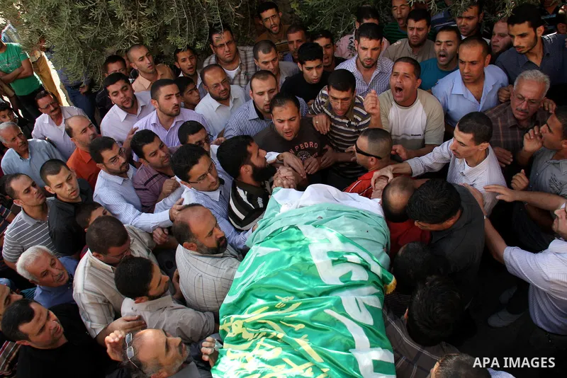 Palestinians carry the body of senior Hamas militant Nashat al-Karmi during his funeral, in the West Bank city of Tulkarem, Friday, Oct. 8, 2010. Israeli troops killed two senior Hamas militants in an early-morning raid...