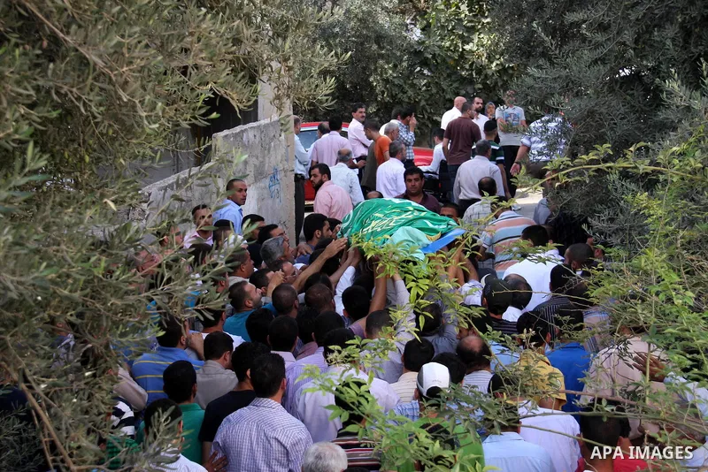 Palestinians carry the body of senior Hamas militant Nashat al-Karmi during his funeral, in the West Bank city of Tulkarem, Friday, Oct. 8, 2010. Israeli troops killed two senior Hamas militants in an early-morning raid...